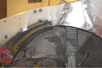 BX vasemman etulokasuojan sisäkaaren paikat 1.JPG